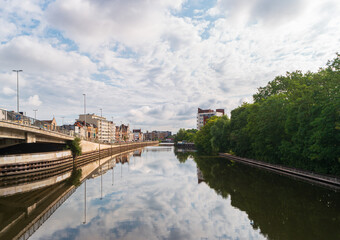 Naklejka premium Ghent, Belgium. Cityscape with view of the river Scheldt (Escaut) and residential buildings along the embankment.