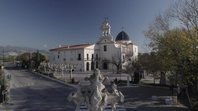 Front aerial approach to the beautiful Basilica Mare de Deu de Lledo on a sunny Fall day, Castello, Valencia, Spain