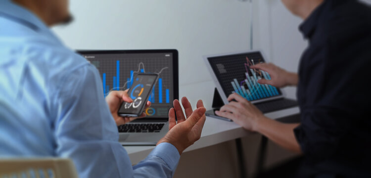 smartphone, laptop and business men planning in conference room meeting, teamwork and discussion of corporate data. Professional people or partner talking, review report analysis digital technology
