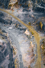 Mining landscape, detailed aerial shot of the stepped terraces and pathways in a rock quarry.