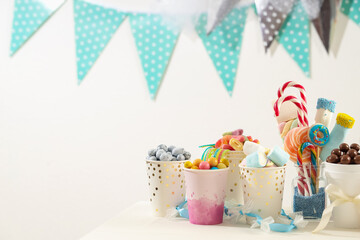 Candy bar. Different yummy sweets on white table indoors. Space for text