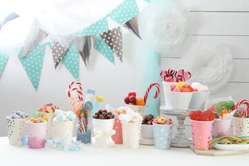 Candy bar. Different yummy sweets on white table indoors