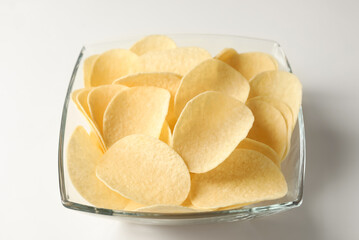 Tasty potato chips on white background, closeup