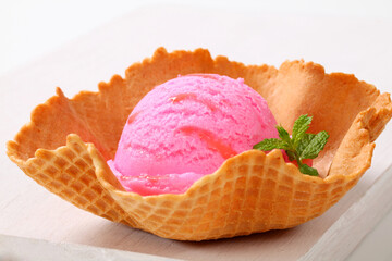 Pink ice cream in a wafer bowl