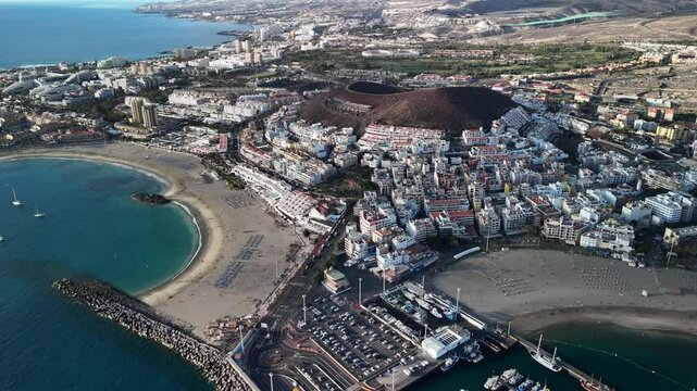 the beauty of Tenerife Los Cristianos with vibrant coastal views and bustling marina activities