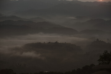 Morning mist in the valley, high angle view on the mountain
