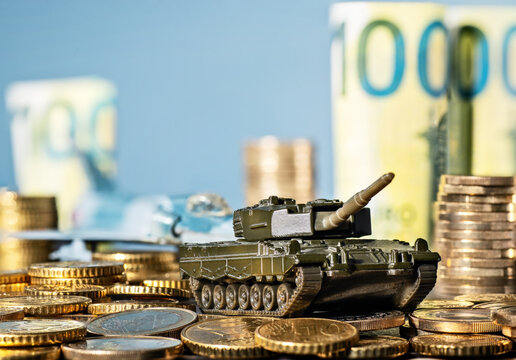 Tank and fighter plane with lots of coins and banknotes