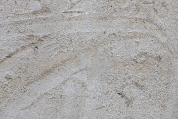 Texture of casually smoothed concrete plaster. Surface of an old dirty concrete wall or floor with traces of strokes, high resolution.