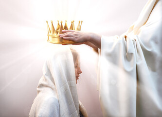 Hands placing a crown on a woman's head