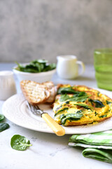 Omelet stuffed with spinach and cheese