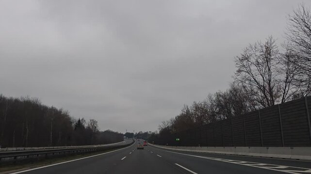 Timelapse video from car driving on D1 highway between Brno and Prague, illustrating major Czech motorway and daily commuting route-weeknd low traffic with cloudy sky and clouds before rain