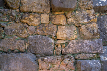 Stone wall of the ancient synagogue at Bar'am National Park on Mount Meron in the Upper Galilee in Israel.

