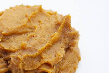 Japanese miso paste on white background.