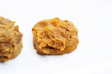 Japanese miso paste on white background.