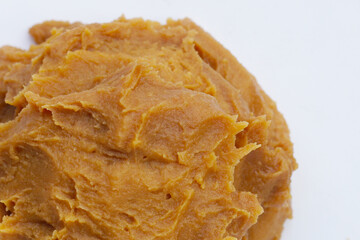 Japanese miso paste on white background.