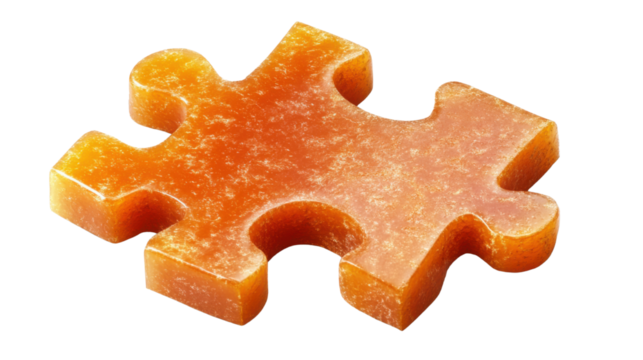 an orange textured puzzle piece with rough texture isolated on white background