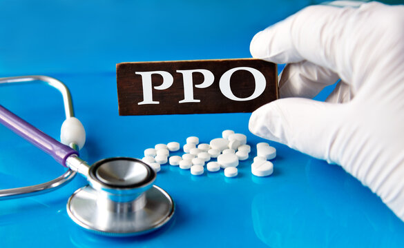 Cubes with the abbreviation PPO in the hand of a doctor.