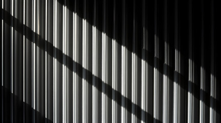 Obraz premium Sunlight creating shadows on corrugated metal surface