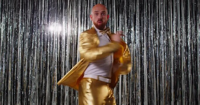 Funny nightclub man dancing in fancy golden costume cool happy dance entertainment, party bright lighting background, cute disco dance hall discotheque, event celebration performance, nighttime fun