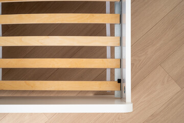 Explore the design of a cozy bed frame in a modern bedroom setting