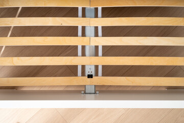 Modern bed frame details in a cozy bedroom showcasing sleek design