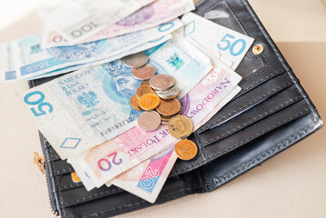 banknotes Polish zloty money with a calendar for paying utility bills