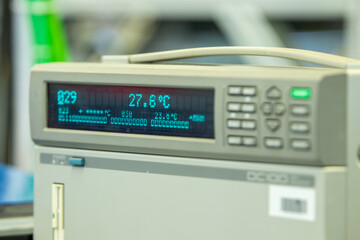 Digital temperature measurement device displaying real-time data in Celsius, used in laboratory or industrial settings for monitoring thermal conditions and testing