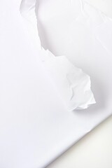Unique piece of white paper with a hole in it isolated on a clean white background for creative design projects