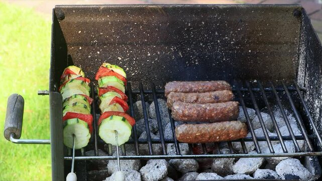 cevapcici and vegetable skewers on grill
