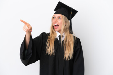 Young university graduate caucasian woman isolated on white background pointing away