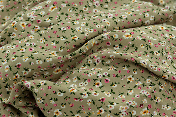 A lightweight, flowing fabric for sewing clothes. Staple fabric is folded to form a textured...