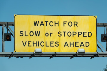 Watch for slow or stopped vehilces ahead sign on the interstate 10 freeway in Los Angeles California.