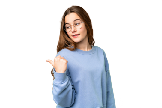 Teenager girl over isolated chroma key background pointing to the side to present a product