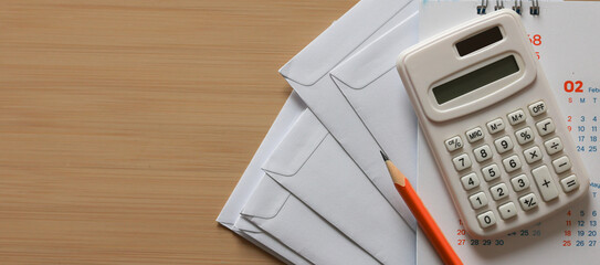 close up top view on calculator and open over calculator and group of invoice letter mail and from...