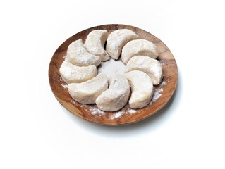 Kue putri salju or Snow princess cookies on plate isolated on white background 