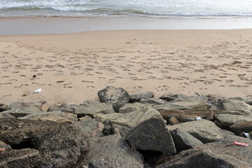 Aerial view of beautiful waves crashing on the rocky island coast, ocean waves and fantastic
