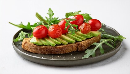 fresh avocado toast topped with cherry tomatoes and arugula on a white background