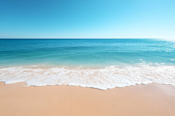 Fototapeta premium Serene coastal view featuring a sandy beach, ocean waves, and a clear blue sky, creating a tranquil and refreshing natural environment