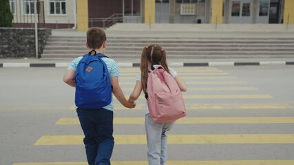School kids crossing the road, Street safety awareness for children, Walking to school with confidence, Two children on the crosswalk, Holding hands for a safe walk, Schoolbag essentials for young