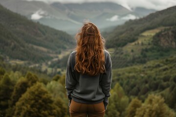 Naklejka premium Woman Looking at Mountain Landscape View, Back View of Girl Enjoying Nature Scenery