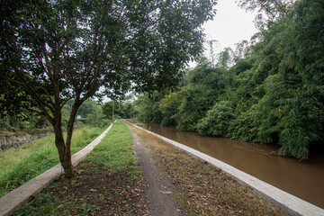 Footpath along the river. The small road is still dirt
