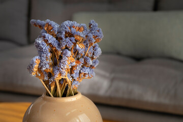 Dried sea lavender (Limonium sinuatum, Statice Sinuata) flowers, light violet color, decoration in vase
