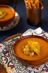 Red Lentil Soup with ingredients on wooden background, top view, copy space. Traditional turkish or arabic lentil and vegetable spicy soup, healthy vegan food.