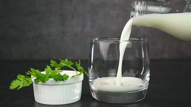 Serving Indian buttermilk in a glass cup.