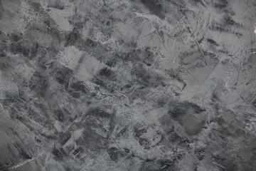 Textured gray abstract background with mix of dark and light shades, creating depth and interest