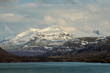 Iceland's diverse landscape features majestic mountains, dramatic coastlines, glaciers, and...