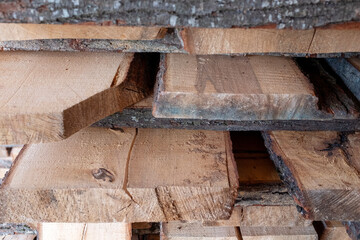 Wooden planks. Air-drying timber stack. Edged boards.Building material.The material is made of wood Wood air drying (seasoning lumber or wood seasoning). Timber. Lumber. Close-up.