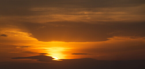 Beautiful bright evening sunset sky with dark  clouds. Sunset sky background.