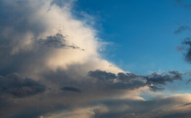 Beautiful bright evening sunset sky with dark  clouds. Sunset sky background.