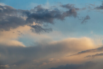 Beautiful bright evening sunset sky with dark  clouds. Sunset sky background.